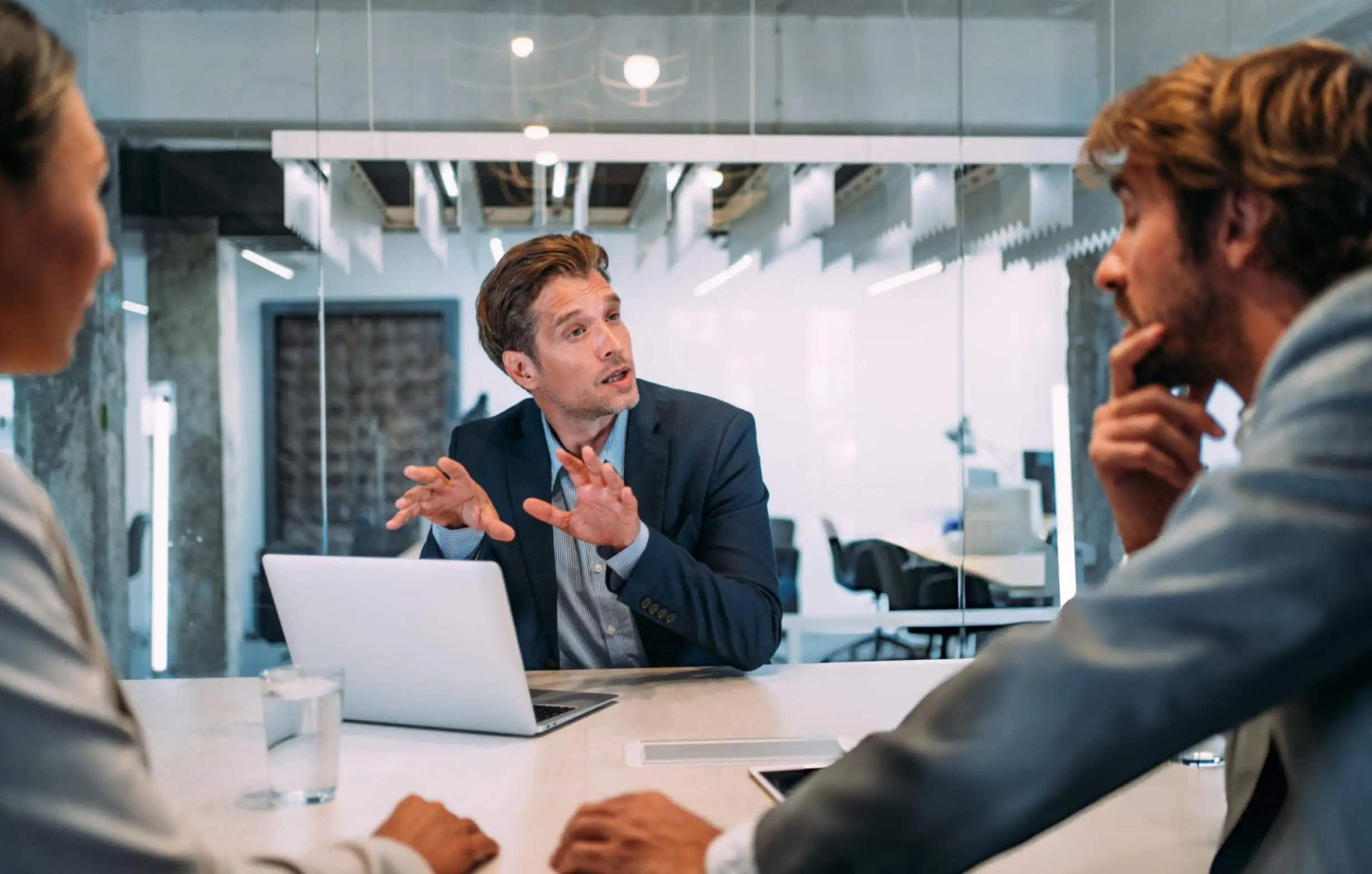 Group of business persons talking in the office during business consulting 